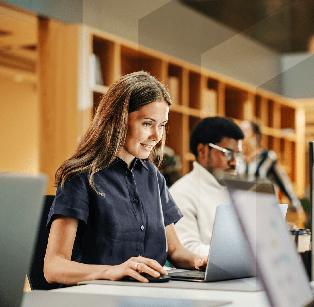 woman_sat_at_desk_small-min-2